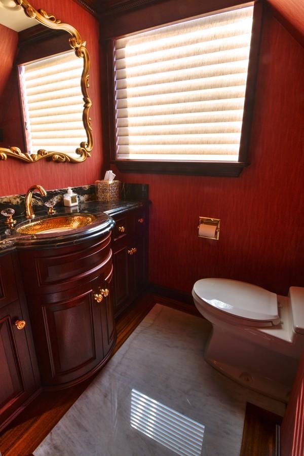 a bathroom with a sink and a toilet aboard SCORPIO Yacht for Sale