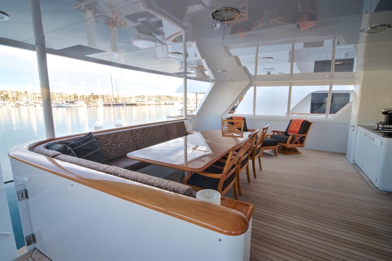a room with a table and chairs aboard SCORPIO Yacht for Sale