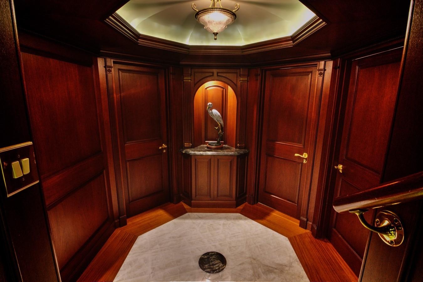 a bedroom with a large mirror aboard SCORPIO Yacht for Sale