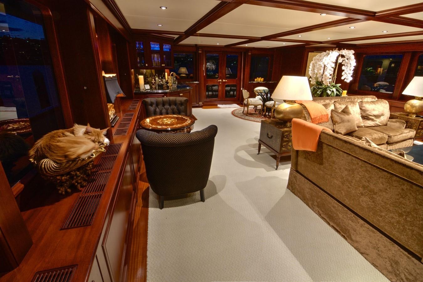 a living room with a large wood floor aboard SCORPIO Yacht for Sale