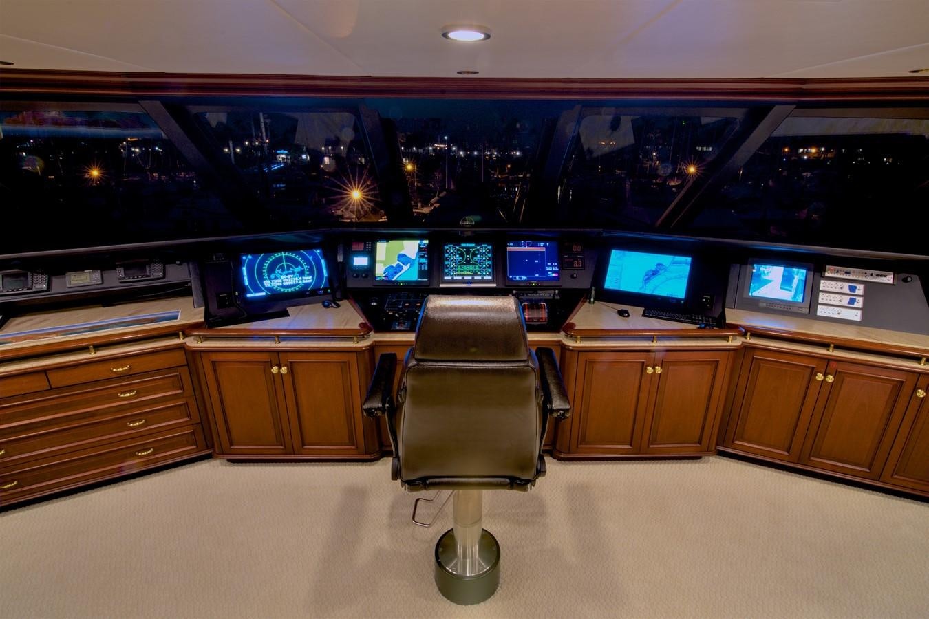 a chair in a room with a tv on the wall aboard SCORPIO Yacht for Sale