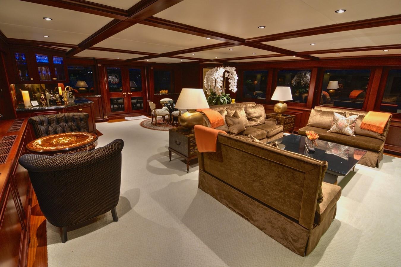 a living room with a fireplace aboard SCORPIO Yacht for Sale