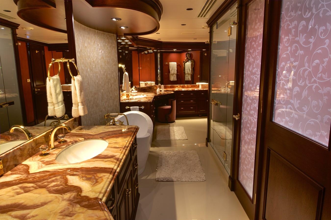a bathroom with a countertop sinks and mirrors aboard SCORPIO Yacht for Sale