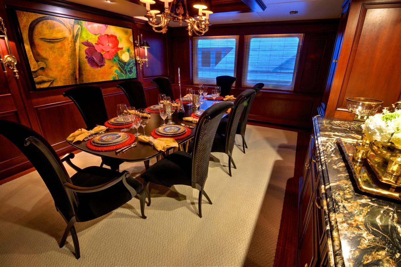a dining room with a table and chairs aboard SCORPIO Yacht for Sale