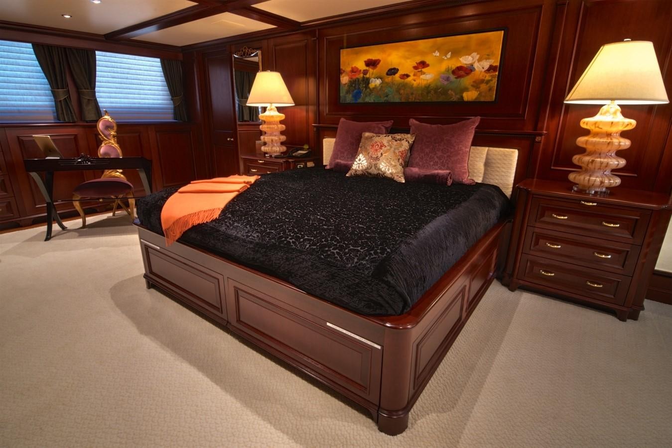 a bed with a black comforter aboard SCORPIO Yacht for Sale
