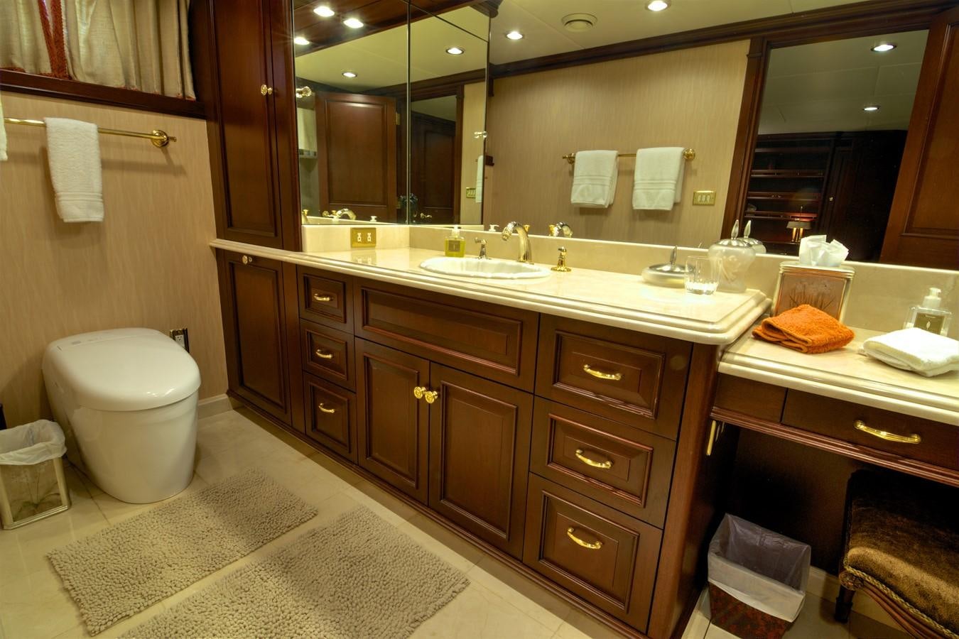 a bathroom with a large mirror aboard SCORPIO Yacht for Sale