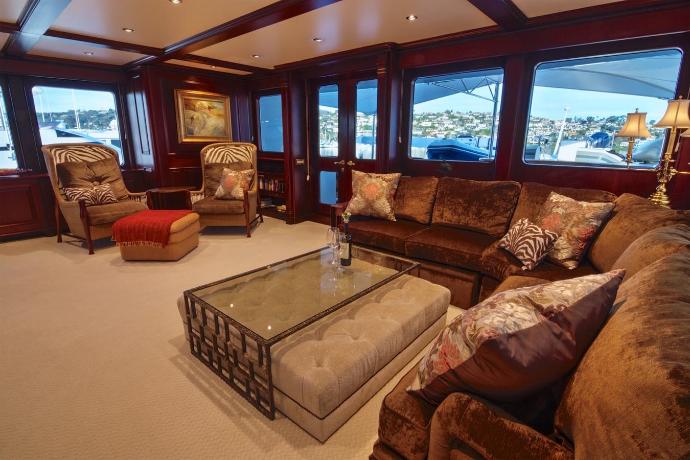 a living room with a large window aboard SCORPIO Yacht for Sale