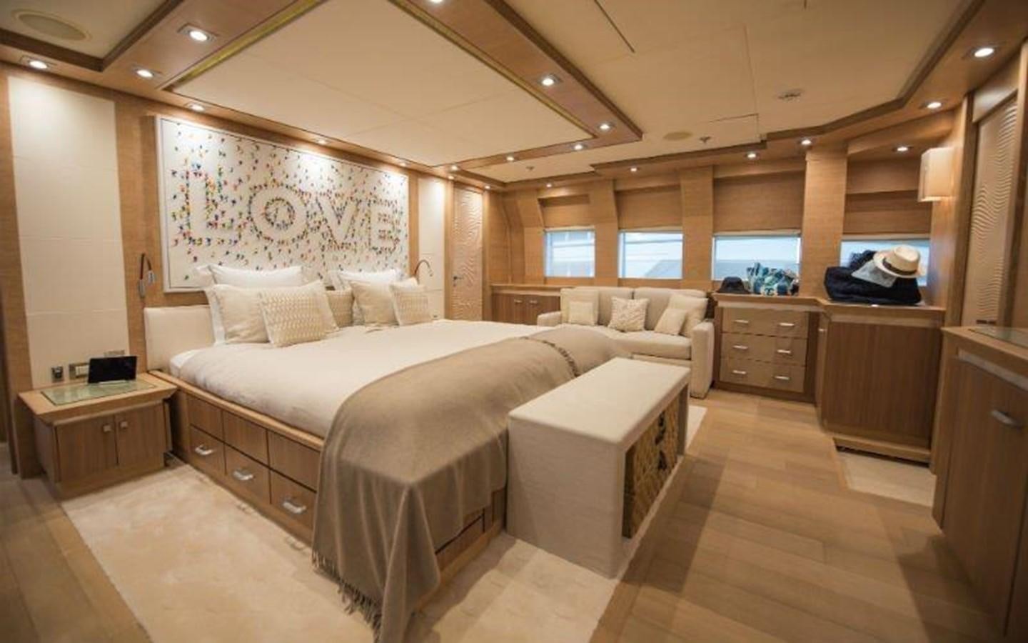 a room with a bed and a couch aboard NORMA JEAN Yacht for Sale