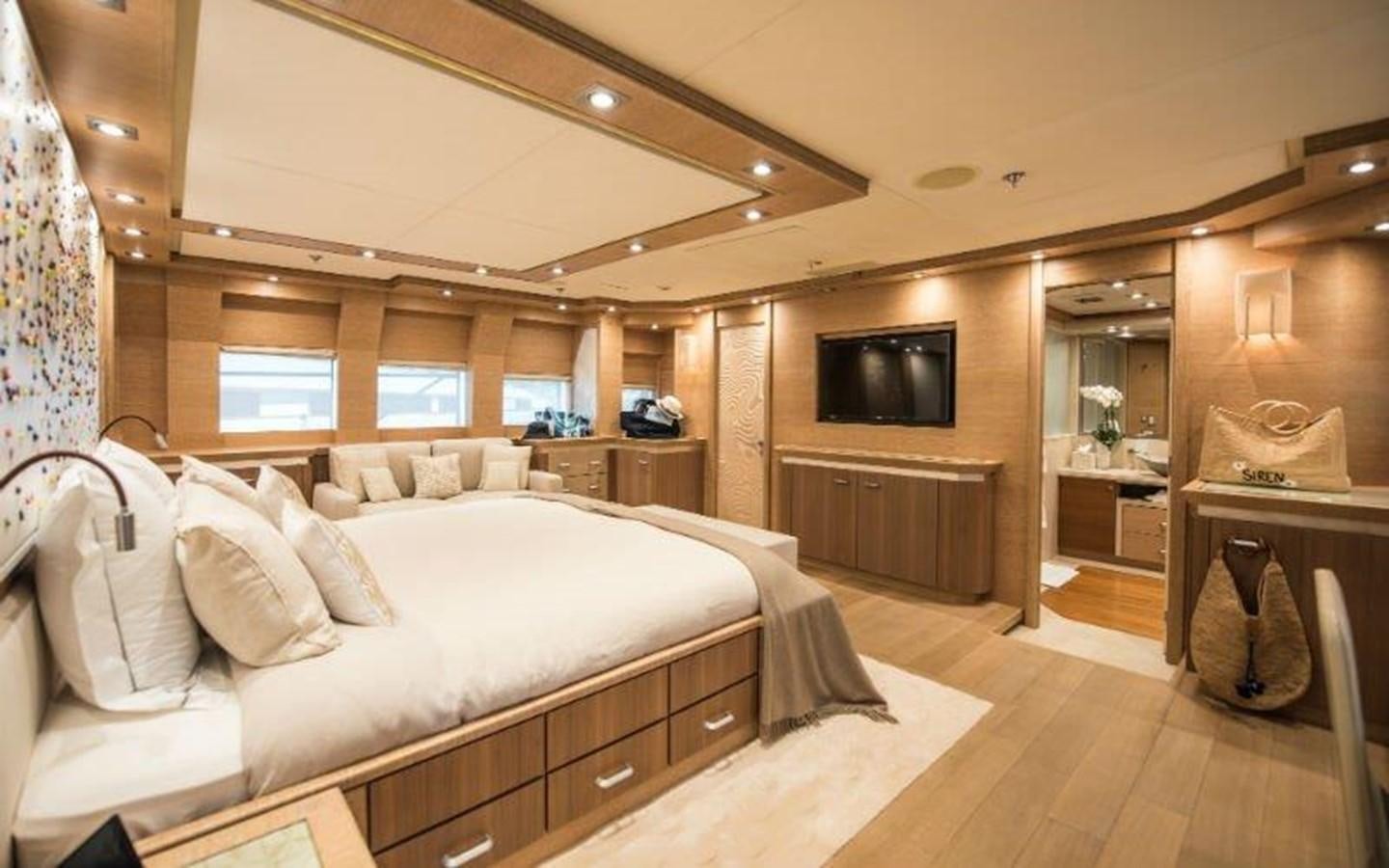 a bedroom with a bed and a tv aboard NORMA JEAN Yacht for Sale