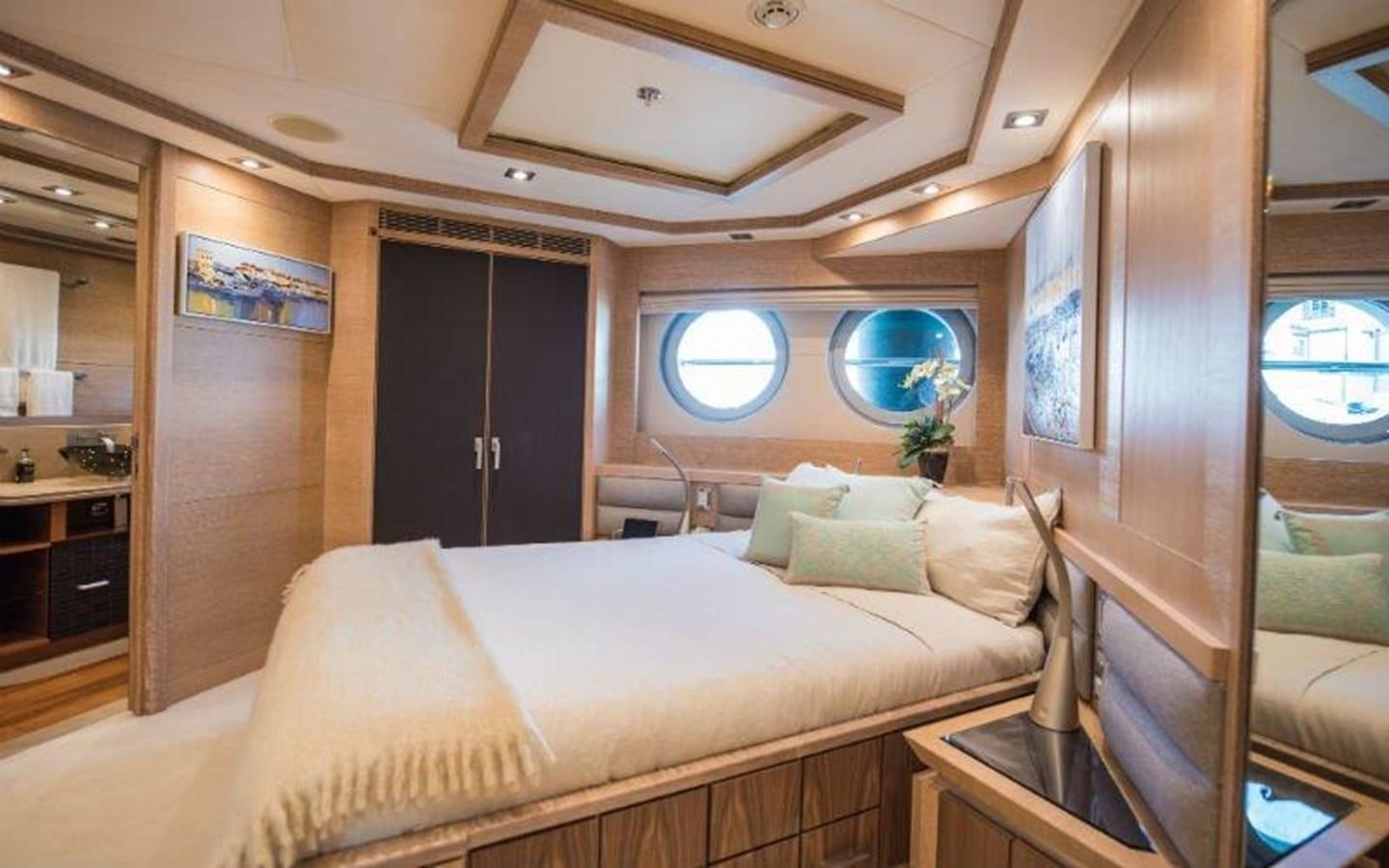 a room with a bed and a window aboard NORMA JEAN Yacht for Sale