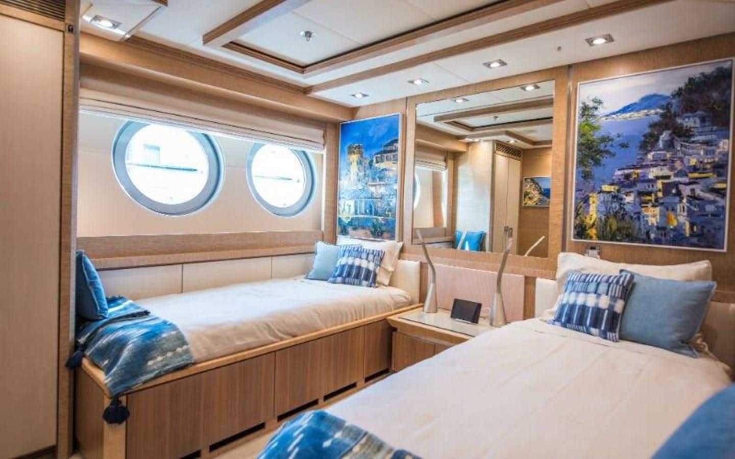 a room with a bed and a couch aboard NORMA JEAN Yacht for Sale