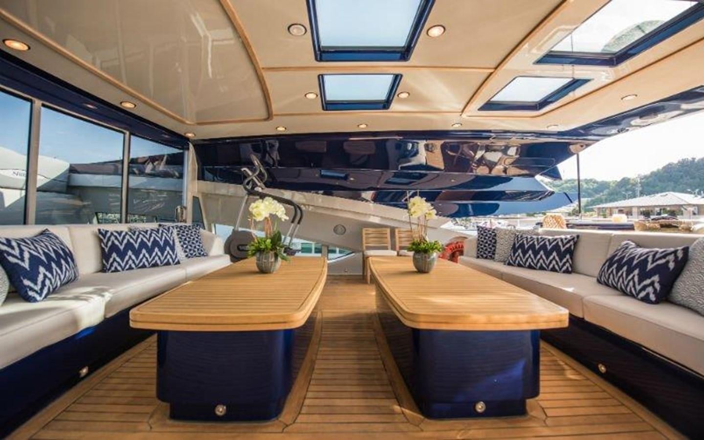 a living room with a couch and a table aboard NORMA JEAN Yacht for Sale