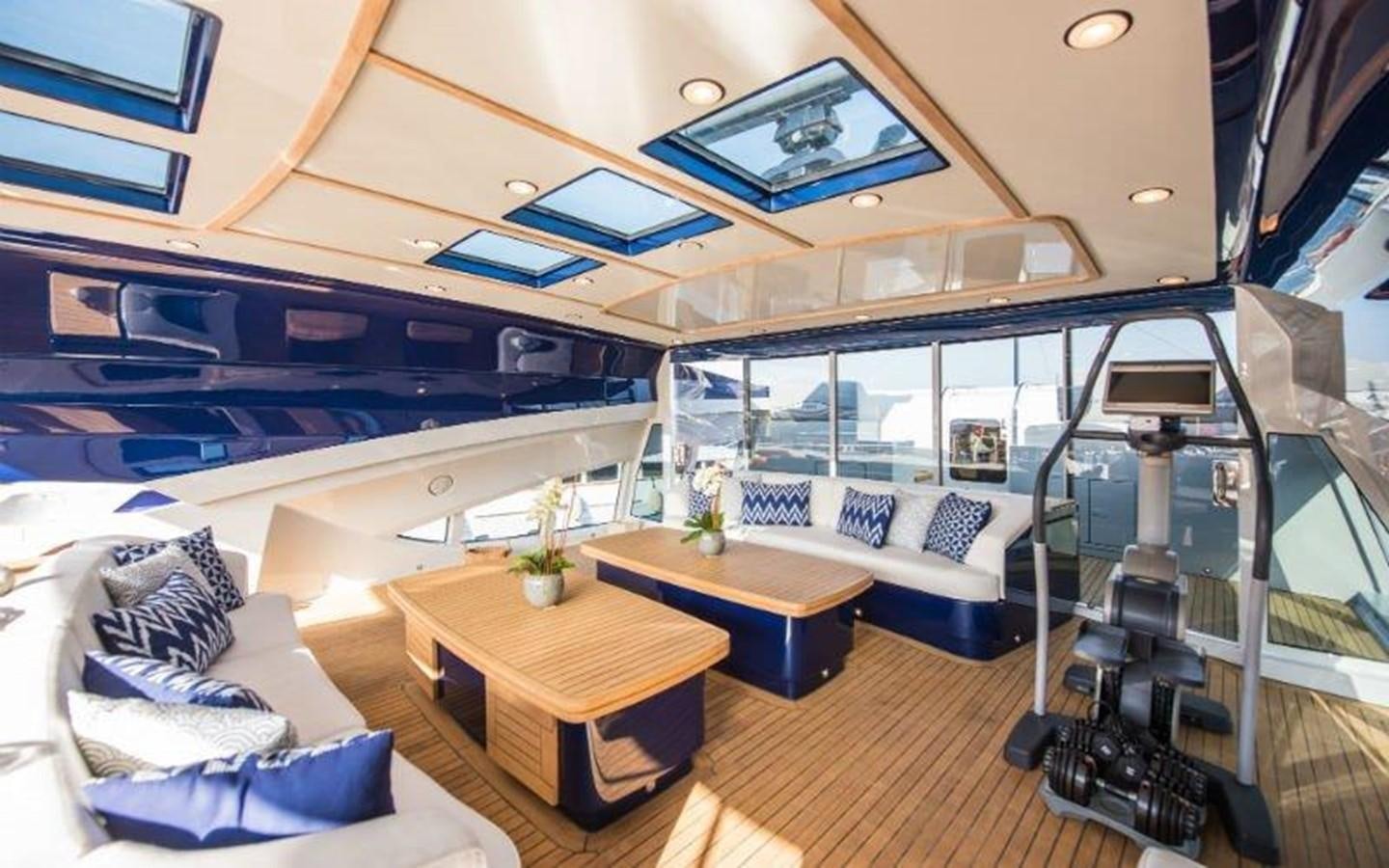 a room with a large window and a table with a large mirror aboard NORMA JEAN Yacht for Sale