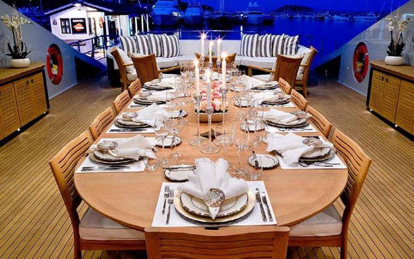 a table set for a dinner party aboard NORMA JEAN Yacht for Sale