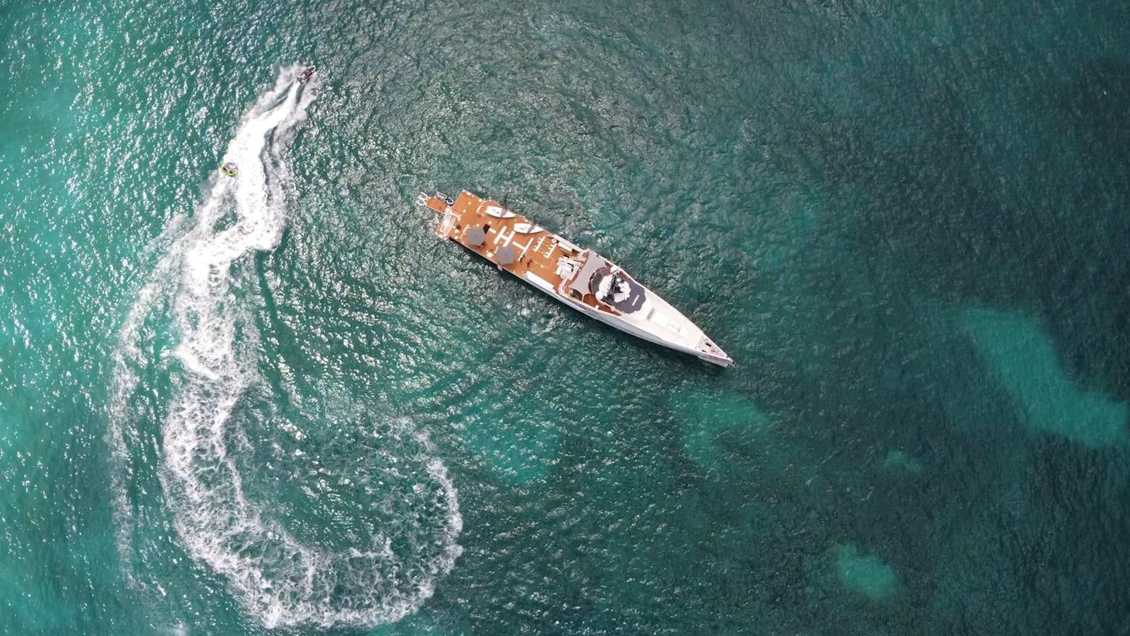 a small boat in the water aboard BAD COMPANY SUPPORT Yacht for Sale