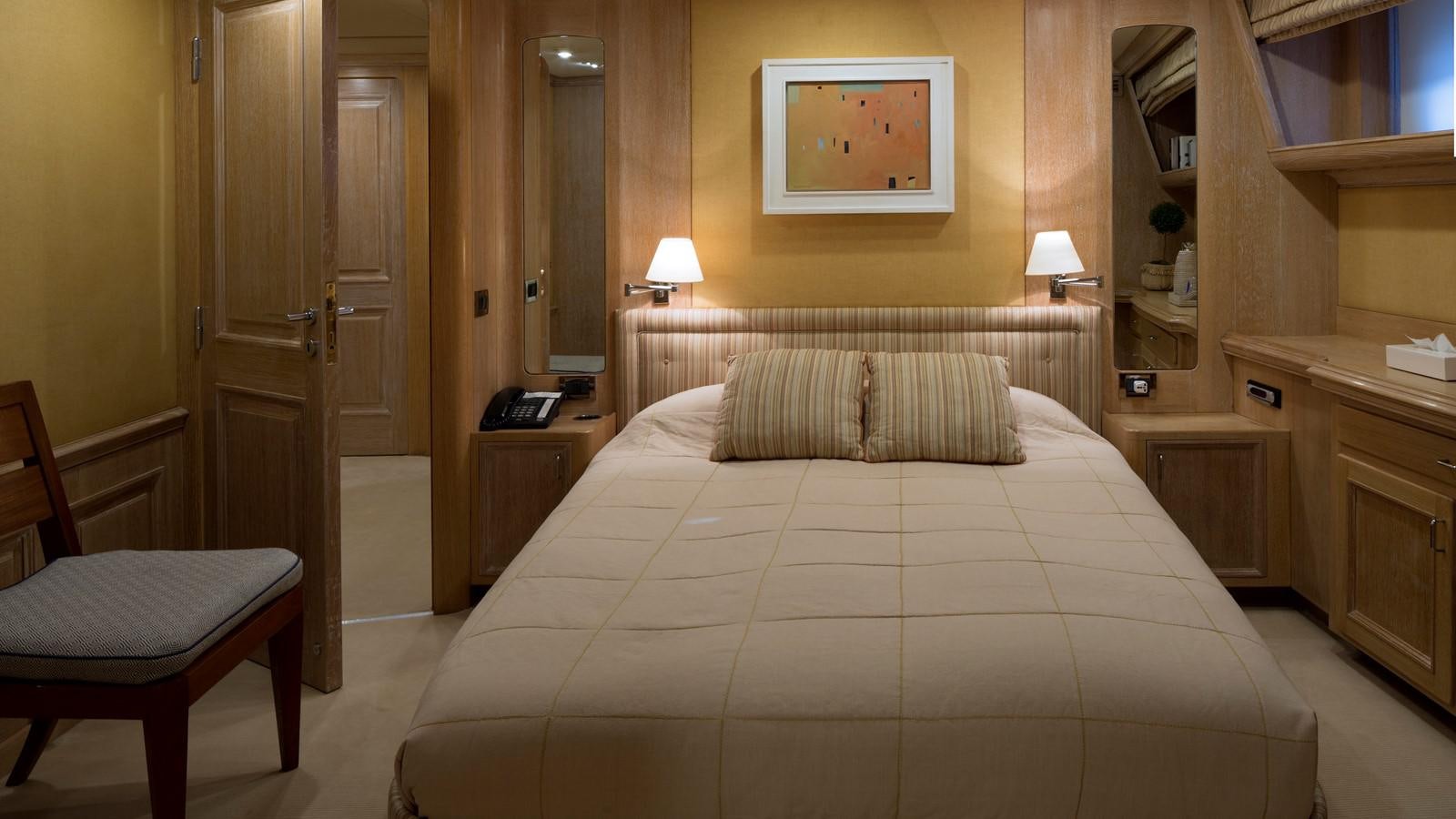 a bed in a hotel room aboard NATALIA V Yacht for Sale