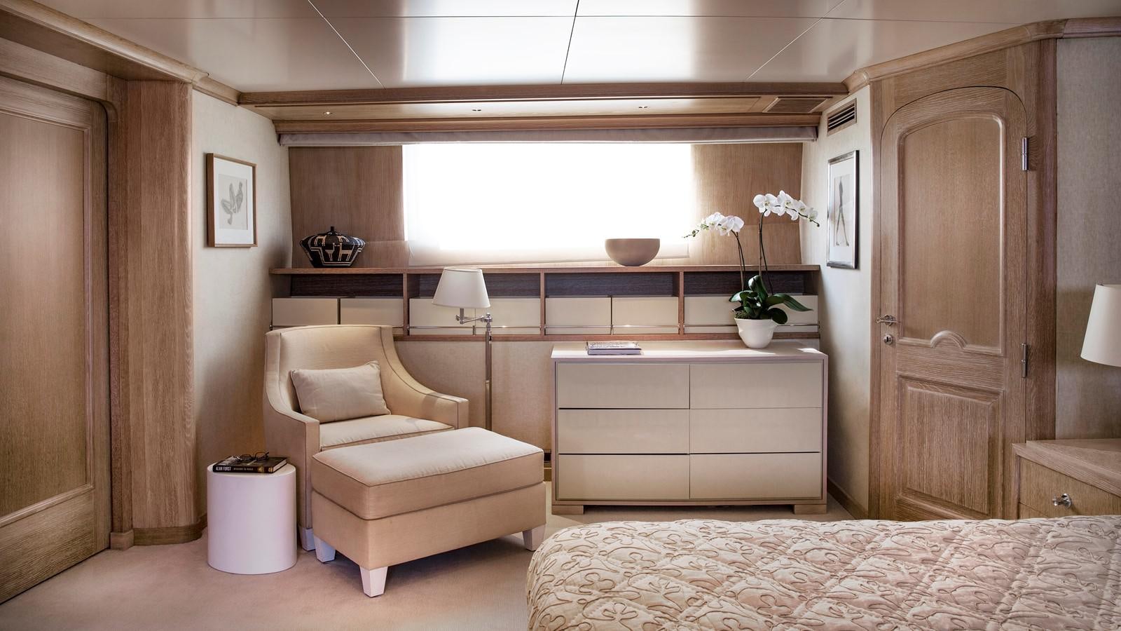 a room with a bed and a desk aboard NATALIA V Yacht for Sale