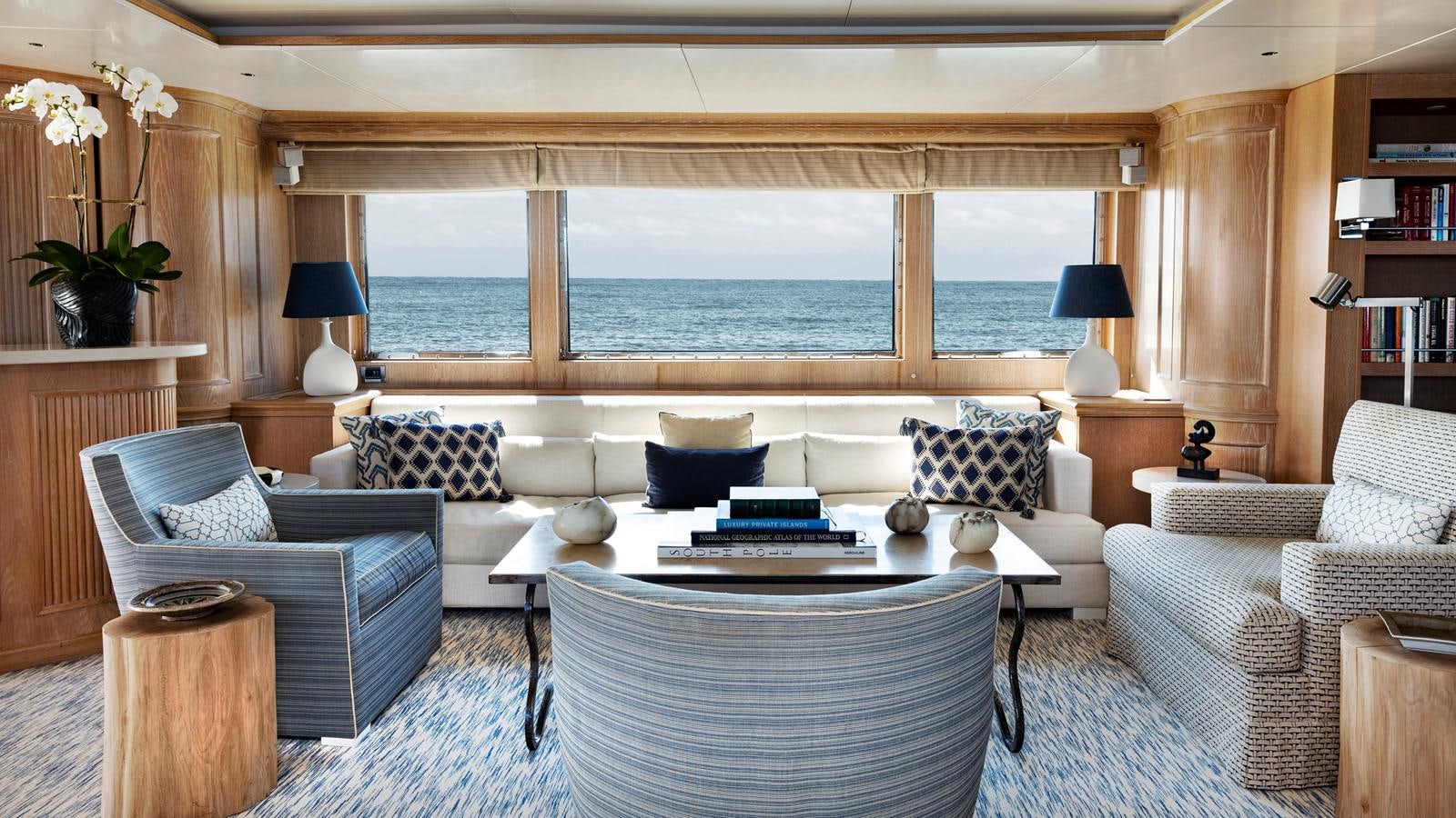 a living room with a large window aboard NATALIA V Yacht for Sale