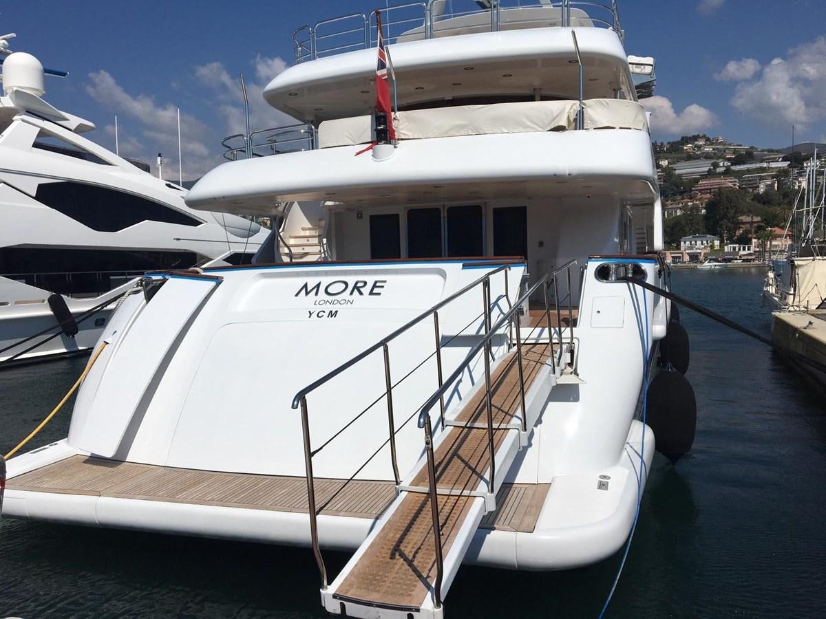 a boat docked at a pier aboard MORE Yacht for Sale
