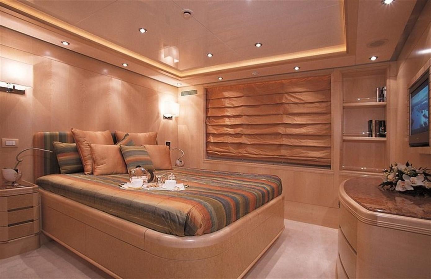 a room with a bed and a tv aboard MORE Yacht for Sale