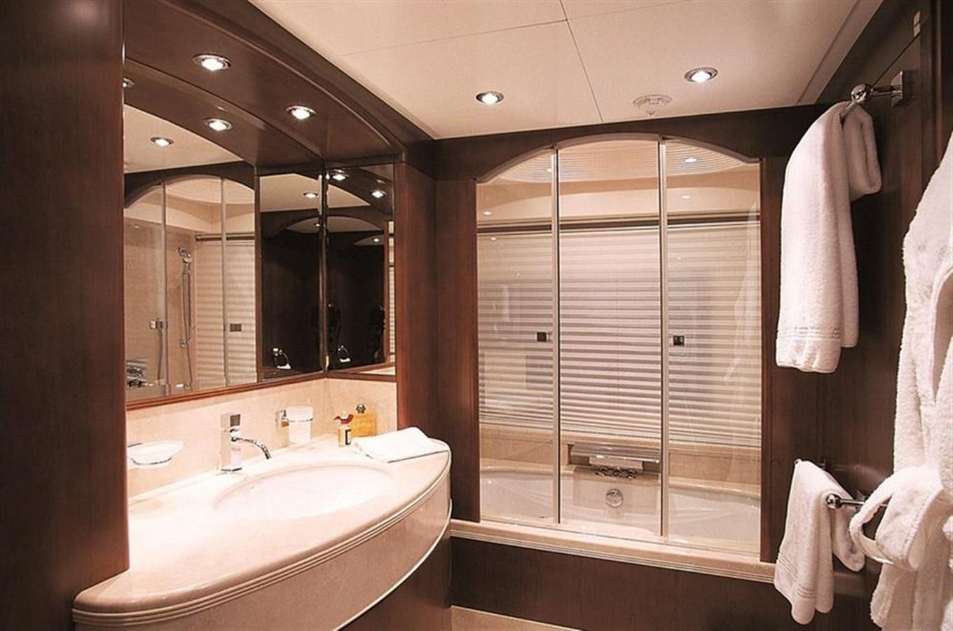 a bathroom with a large mirror aboard MORE Yacht for Sale