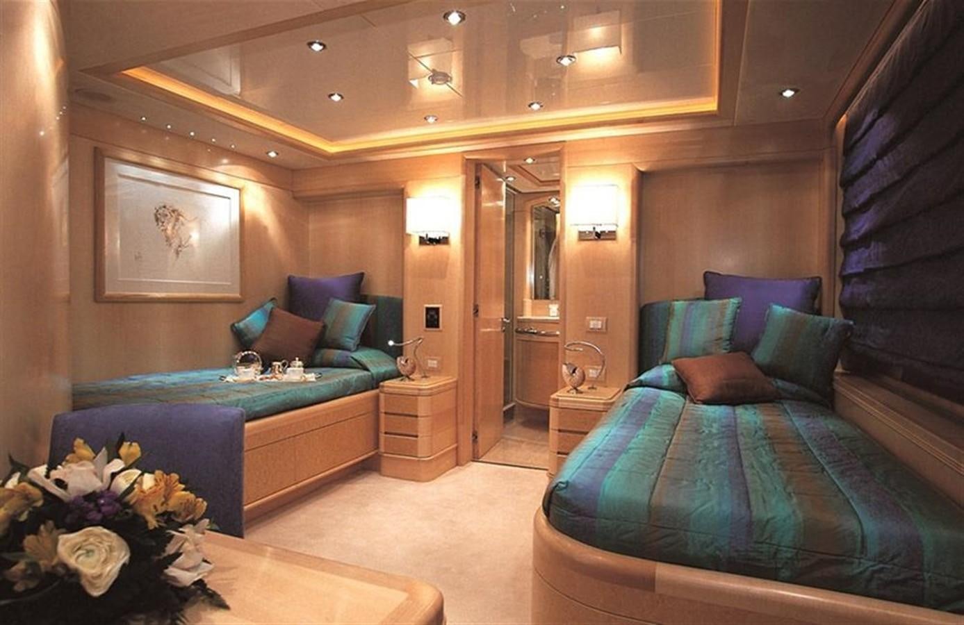 a room with a bed and a couch aboard MORE Yacht for Sale