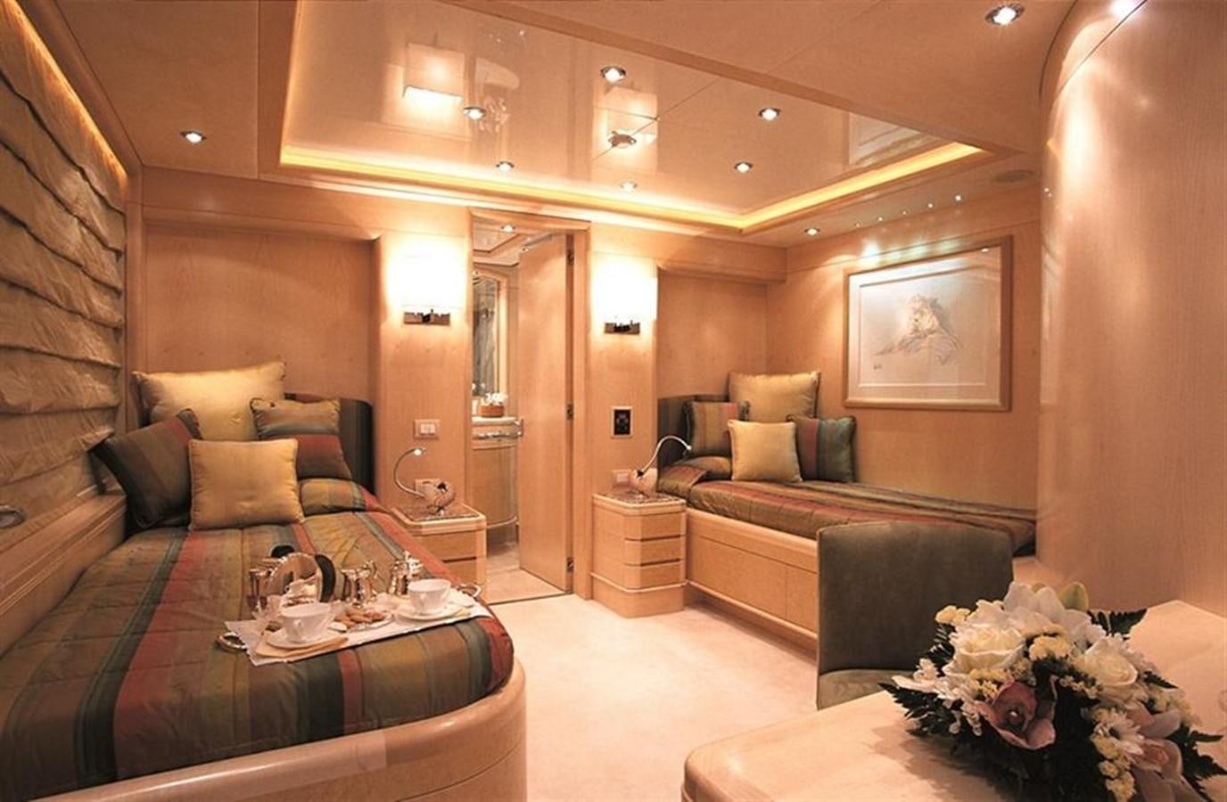 a room with a bed and a couch aboard MORE Yacht for Sale