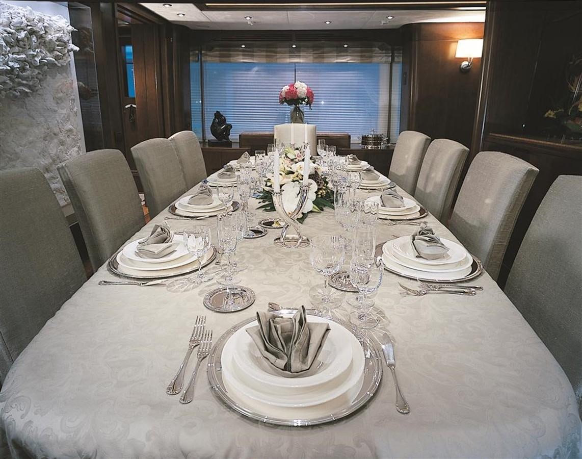 a table set for a dinner aboard MORE Yacht for Sale