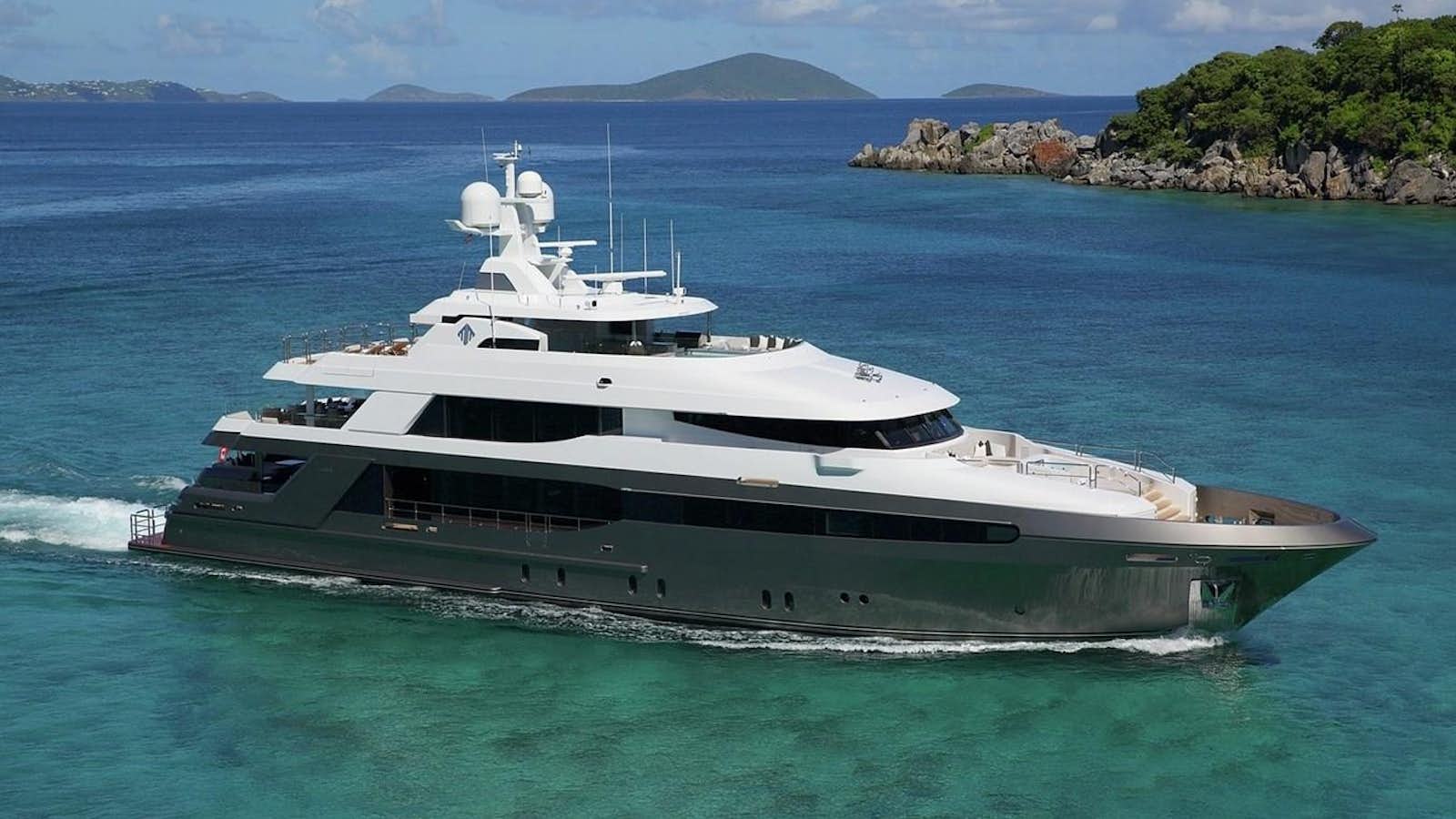 a large white yacht in the water aboard MUCHOS MAS Yacht for Sale