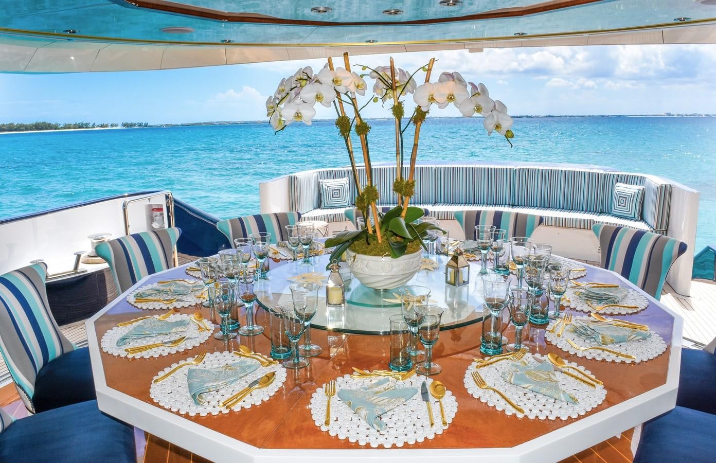 a table set for a dinner aboard OCTOPUSSY Yacht for Sale