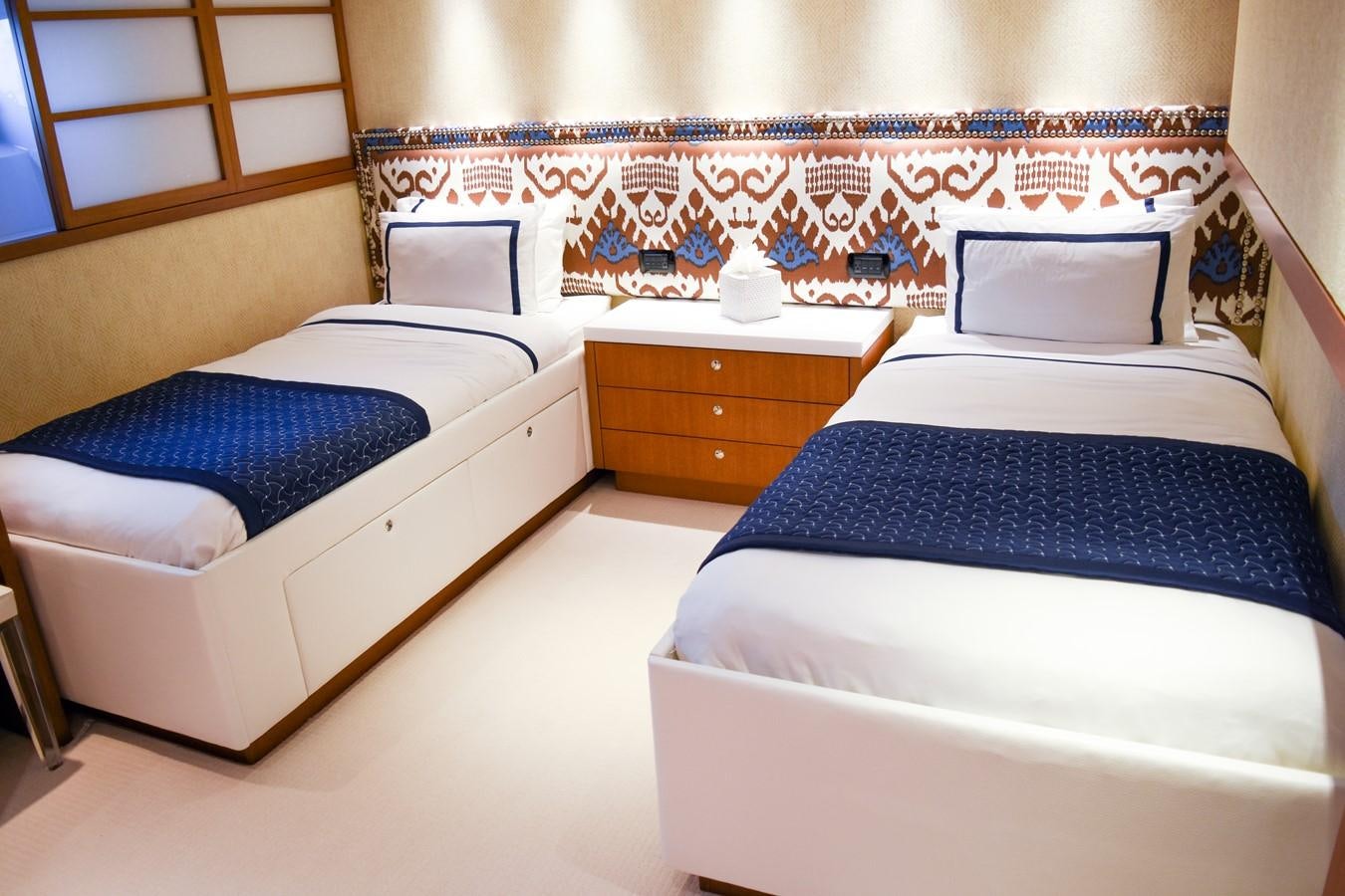 a couple of beds in a room aboard OCTOPUSSY Yacht for Sale