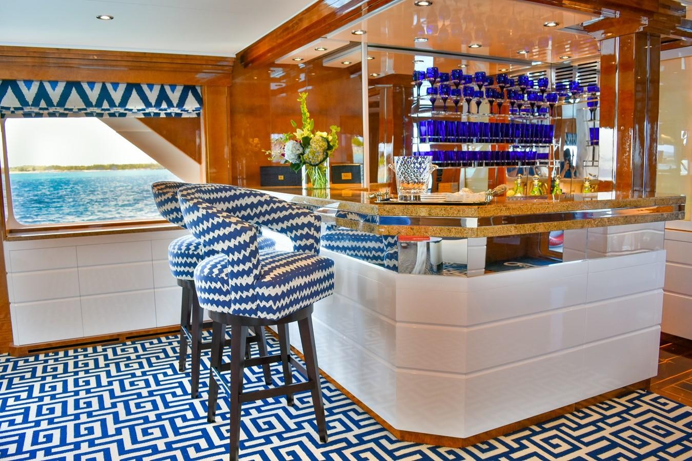 a room with a table and chairs aboard OCTOPUSSY Yacht for Sale