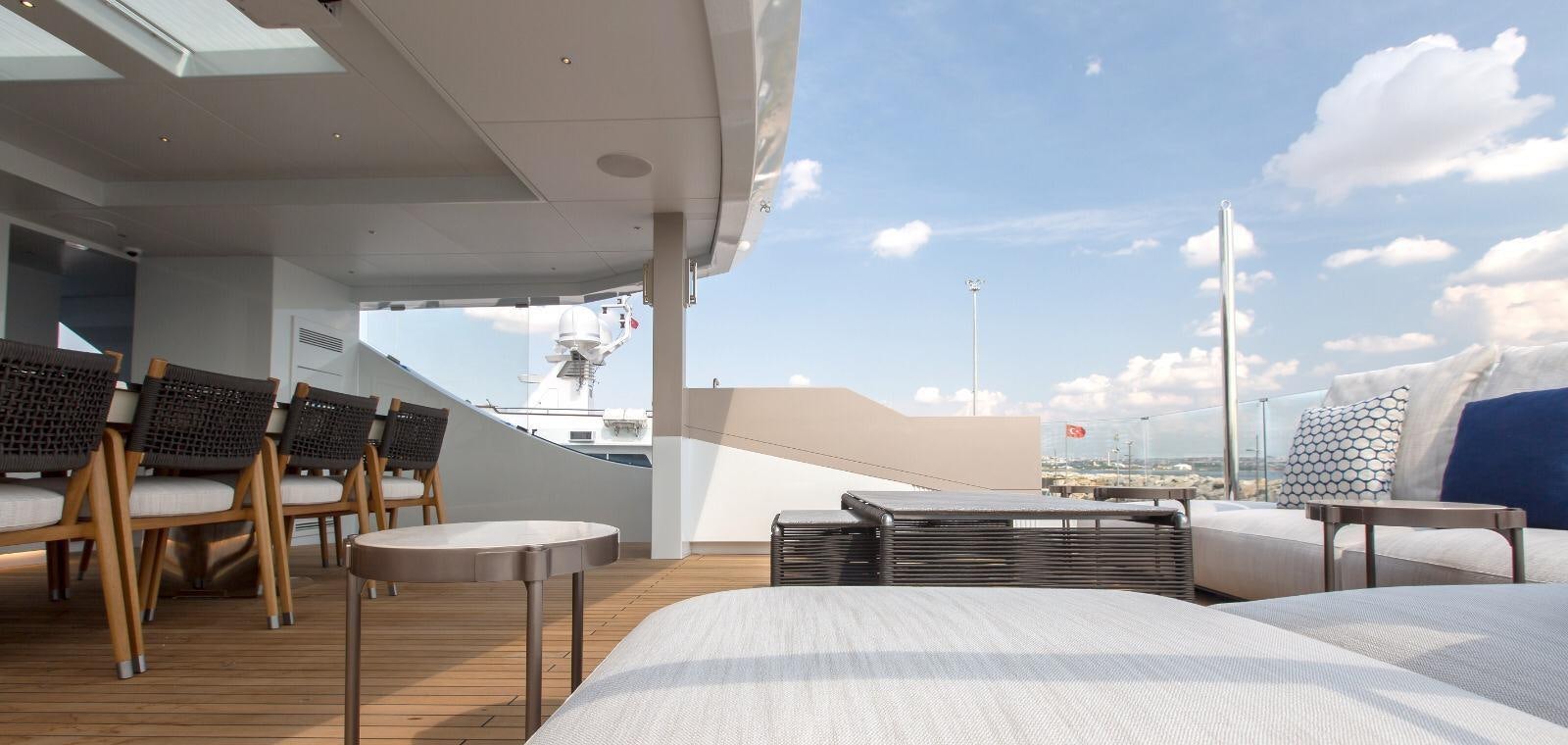 a room with a bed and chairs aboard HALARA (NAME RESERVED) Yacht for Sale