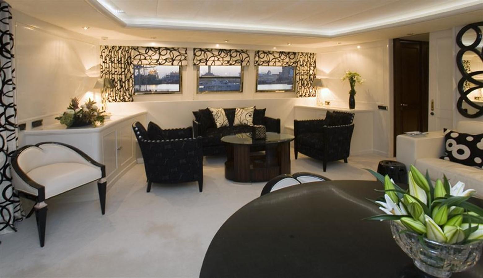 a room with a couch and a table and chairs aboard SEA DREAM Yacht for Sale