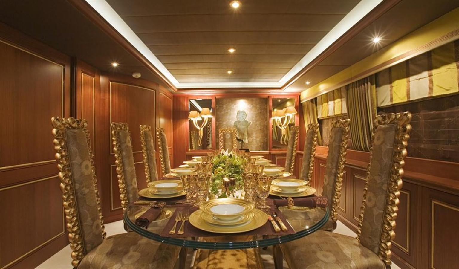 a dining room with a table set aboard SEA DREAM Yacht for Sale
