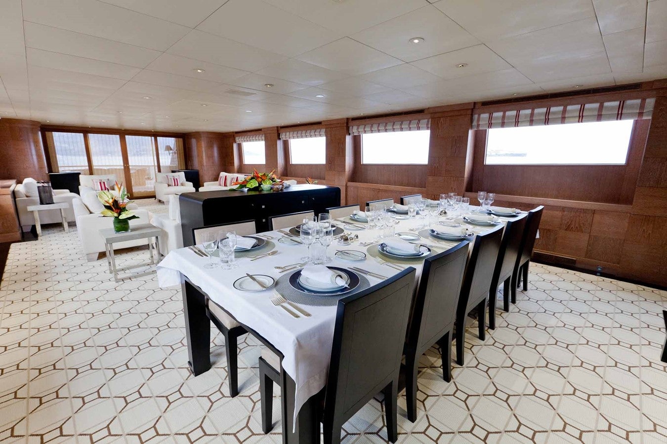 a dining room with white tables aboard ELEMENT Yacht for Charter