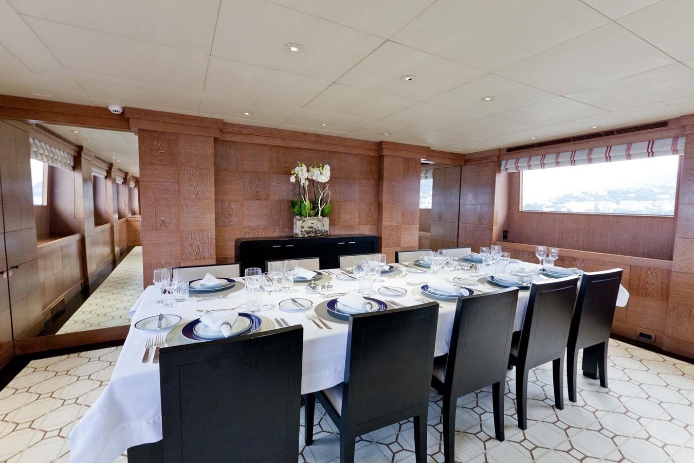 a dining table with chairs aboard ELEMENT Yacht for Sale