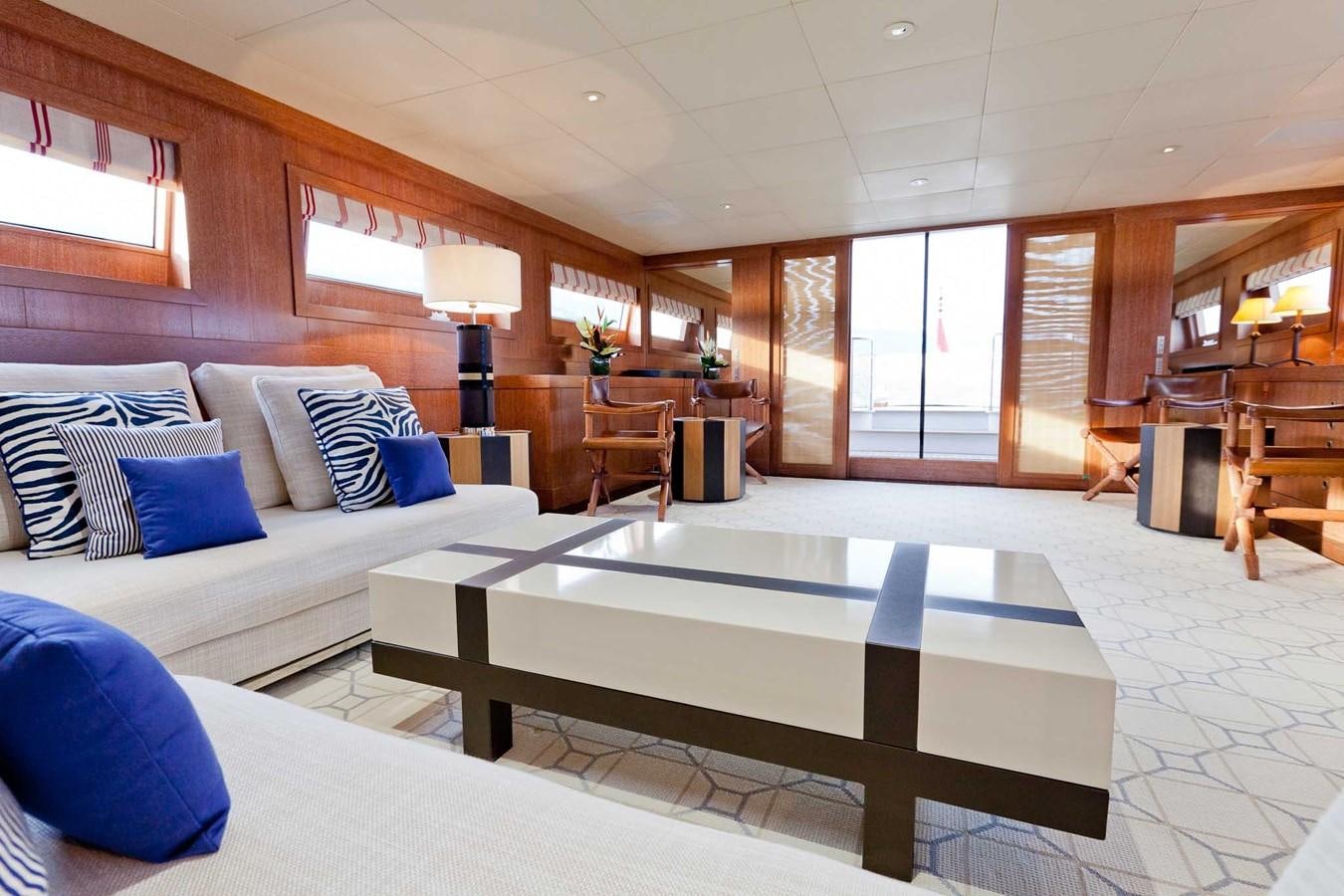 a room with a couch and a table aboard ELEMENT Yacht for Charter