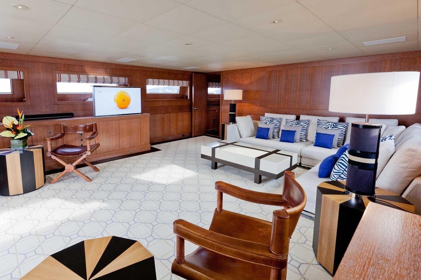 a room with a couch and a table aboard ELEMENT Yacht for Charter