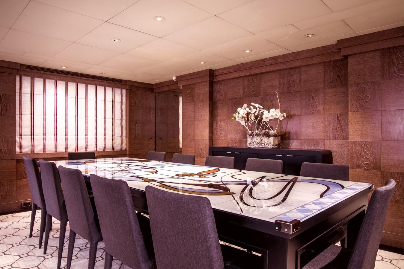 a dining room with a table aboard ELEMENT Yacht for Charter