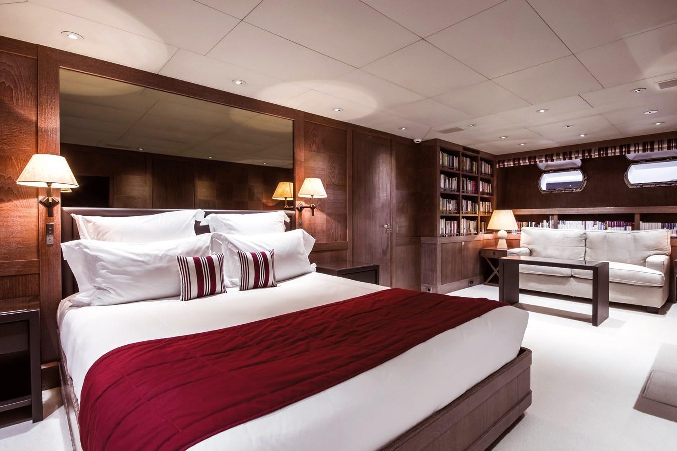 a large bed in a hotel room aboard ELEMENT Yacht for Charter