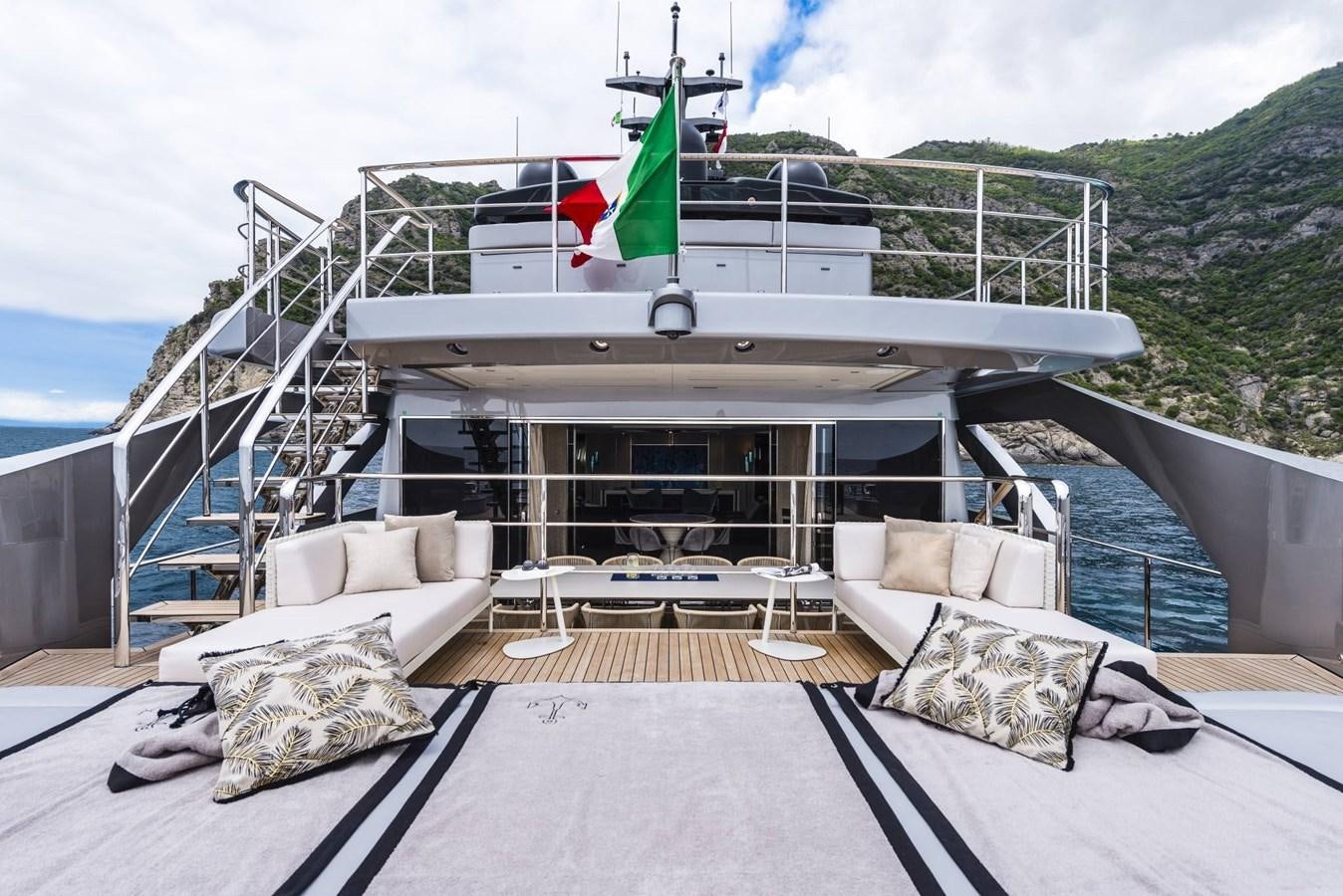 a large white boat on a body of water aboard TOUCH ME Yacht for Sale
