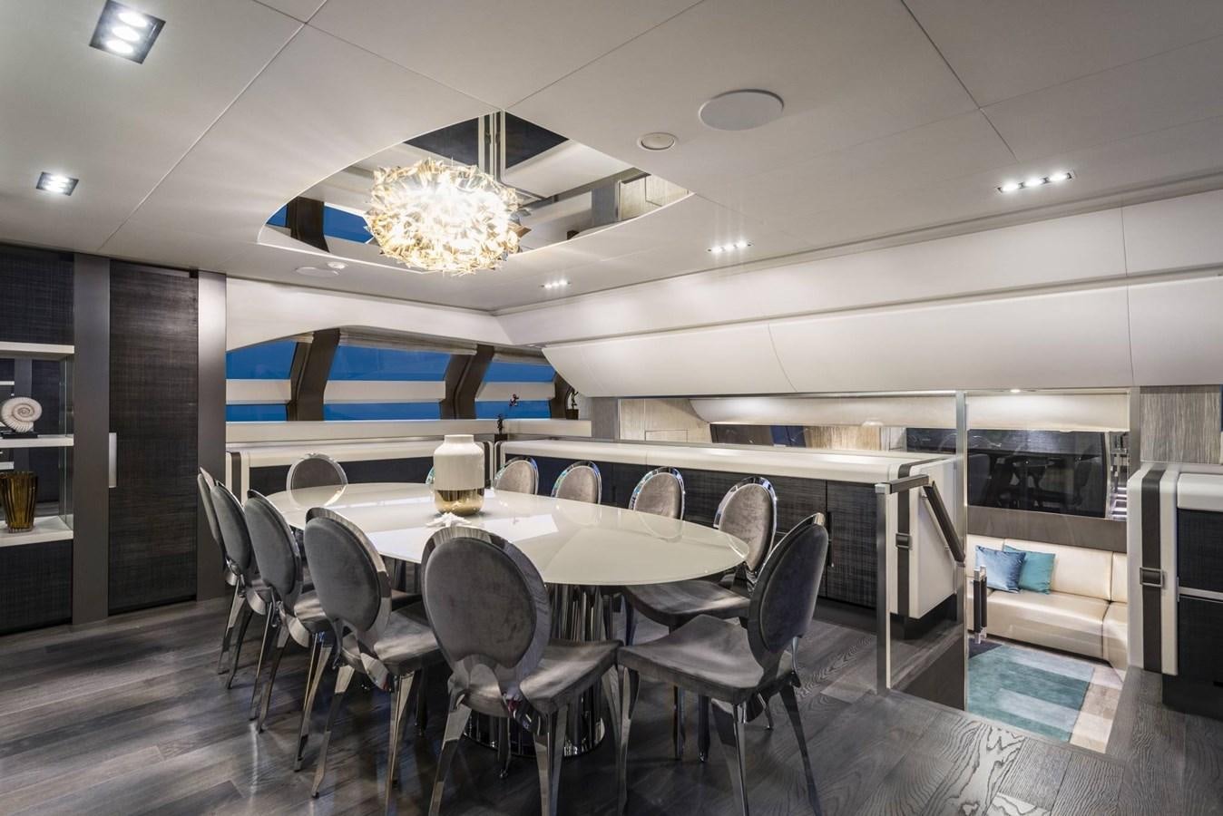 a room with a table and chairs aboard TOUCH ME Yacht for Sale