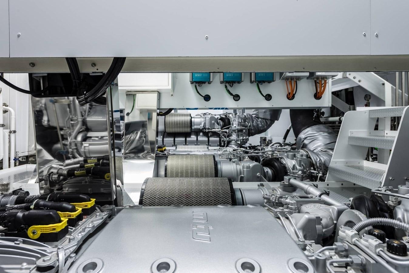 a car with a large engine aboard TOUCH ME Yacht for Sale