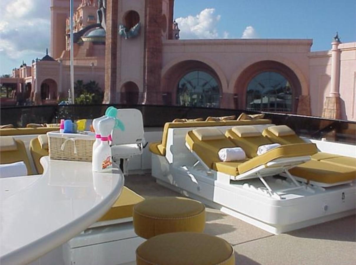 a yellow and white toy car aboard MCY Yacht for Sale