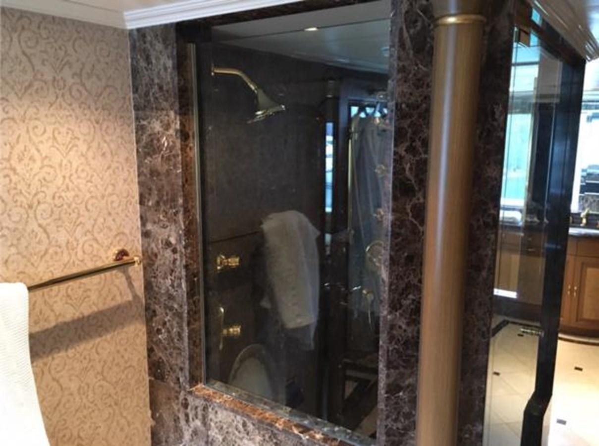 a bathroom with a glass shower aboard MCY Yacht for Sale
