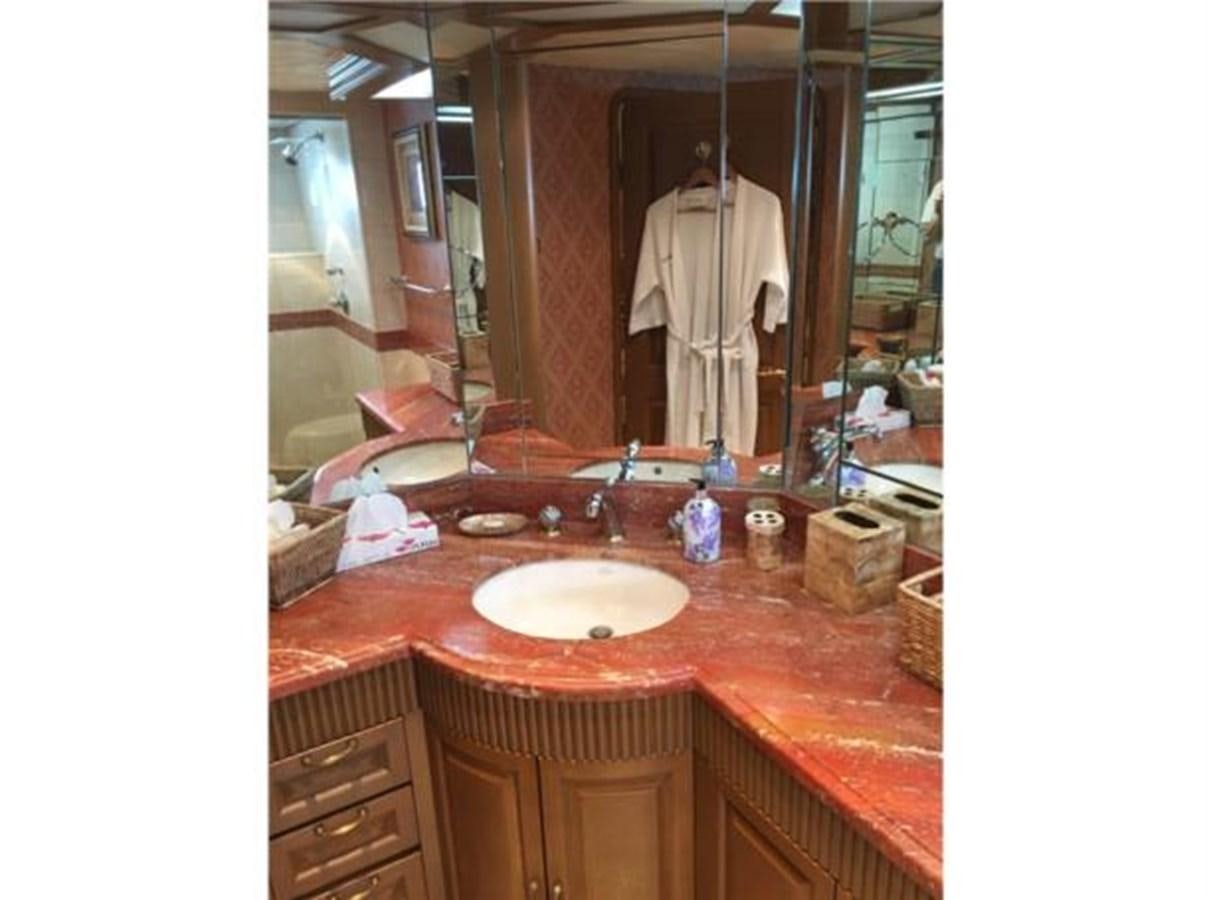 a person taking a picture of themselves in a bathroom mirror aboard MCY Yacht for Sale