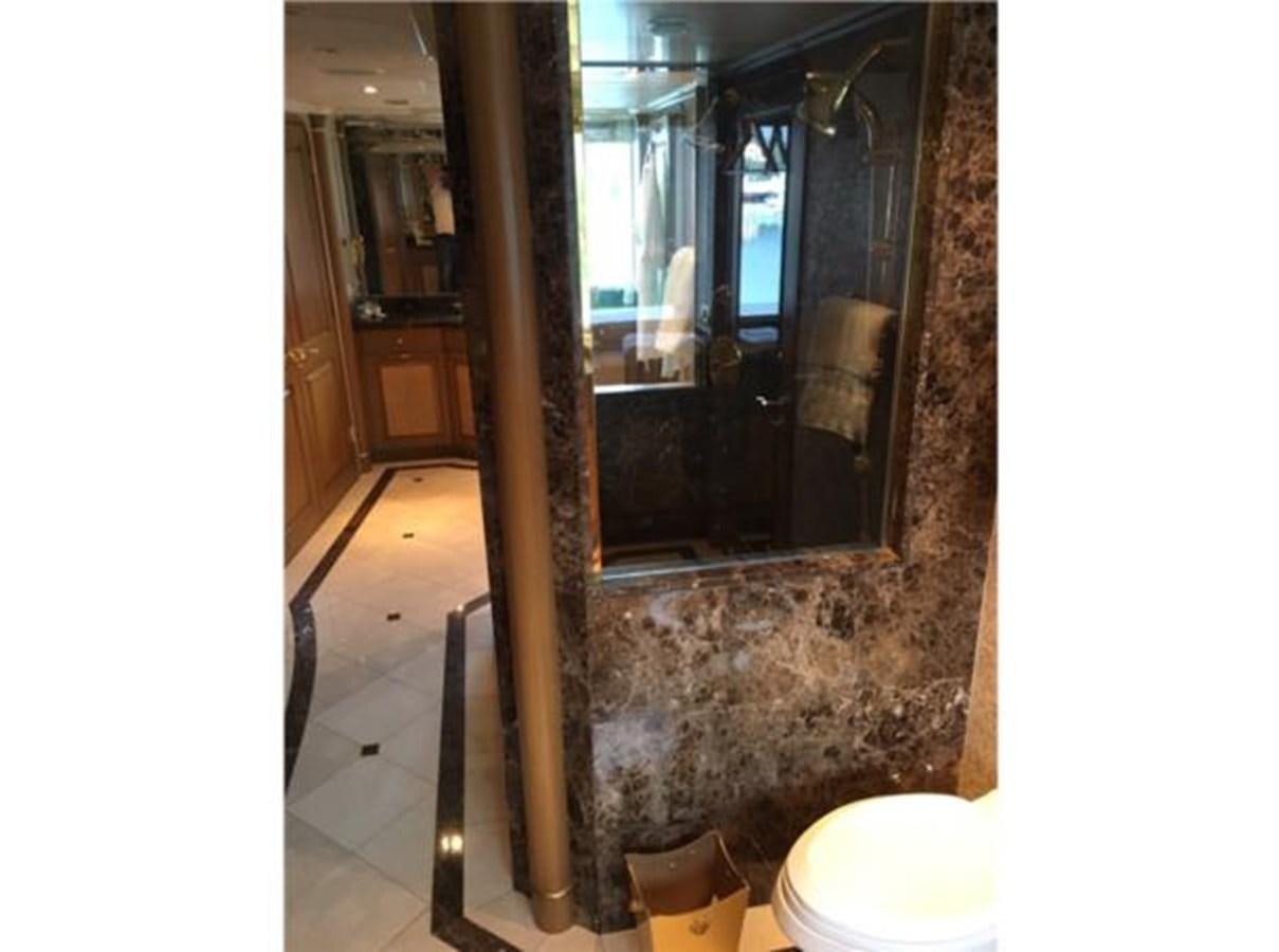 a bathroom with a glass shower aboard MCY Yacht for Sale