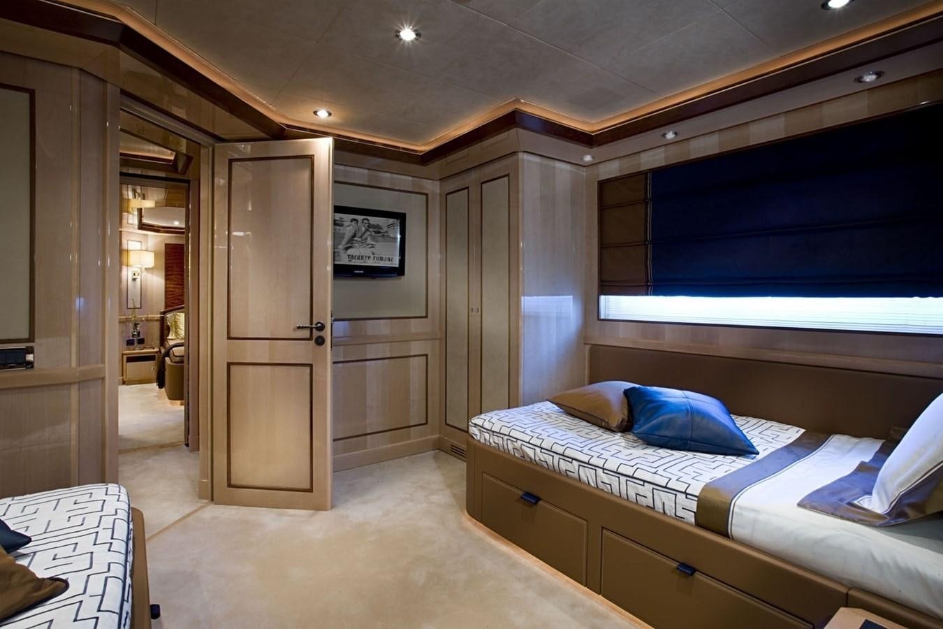 a room with a bed and a closet aboard BEHIKE Yacht for Sale