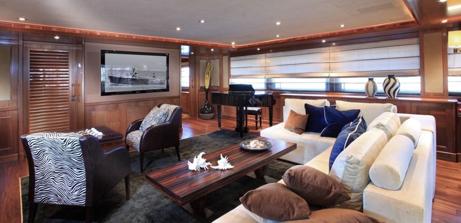 a living room with a couch and a television aboard BEHIKE Yacht for Sale